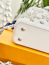 Load image into Gallery viewer, LOUIS VUITTON 2024 - LIMITED EDITION - Capucines Mini Ski Snowflake Satchel Bag