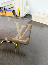 Load image into Gallery viewer, LOUIS VUITTON 2023 Monogram Giant Rectangular Wristlet Pouch
