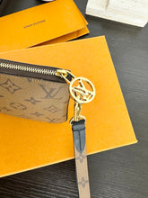 Load image into Gallery viewer, LOUIS VUITTON 2023 Monogram Reverse Square Wristlet Pouch
