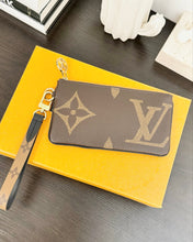 Load image into Gallery viewer, LOUIS VUITTON 2023 Monogram Giant Rectangular Wristlet Pouch
