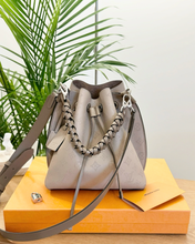 Load image into Gallery viewer, LOUIS VUITTON 2024 Muria Mahina Leather Bucket Bag in Galet Gray
